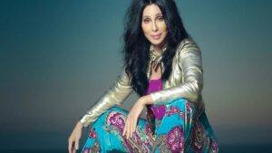 Cher Sitting Credit Press